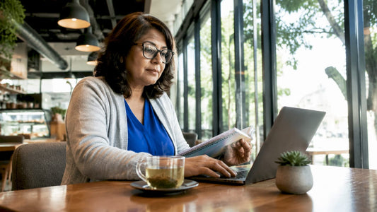 Local entrepreneur typing at home office desk