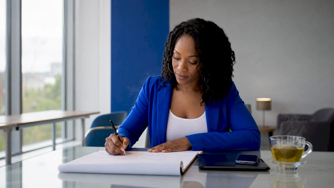 Woman writing go-to-market strategy notes