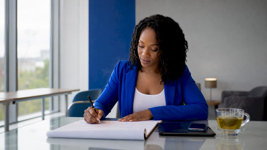 Woman writing go-to-market strategy notes