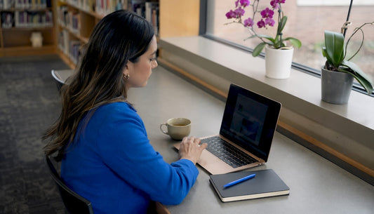 Small business owner working on SEO strategy at coffee shop