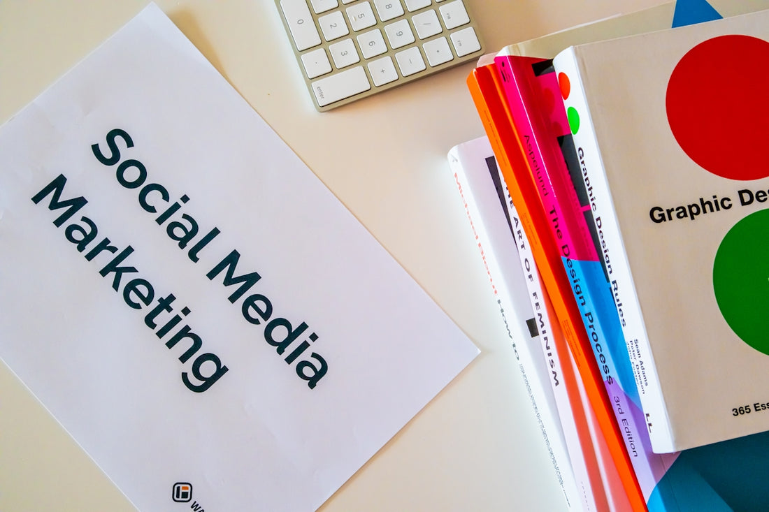 a sign that says social media marketing next to a keyboard